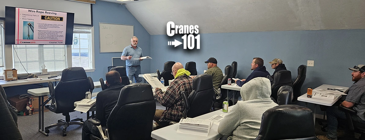 Crane Industry leader teaching a classroom full of heavy equipment operators in the process of getting or maintaining their OSHA required training and licensing